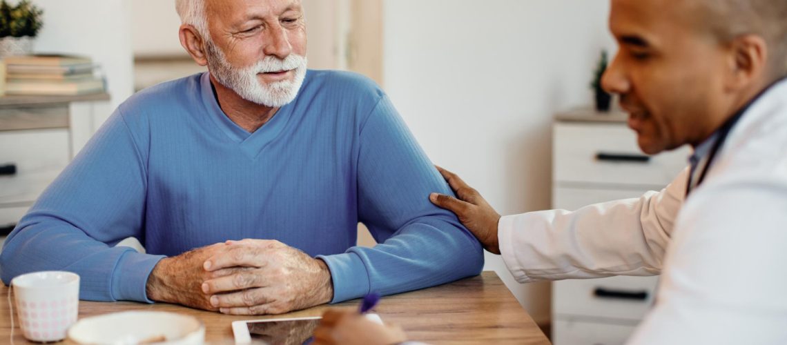 mature-man-talking-african-american-doctor-during-home-visit (1)